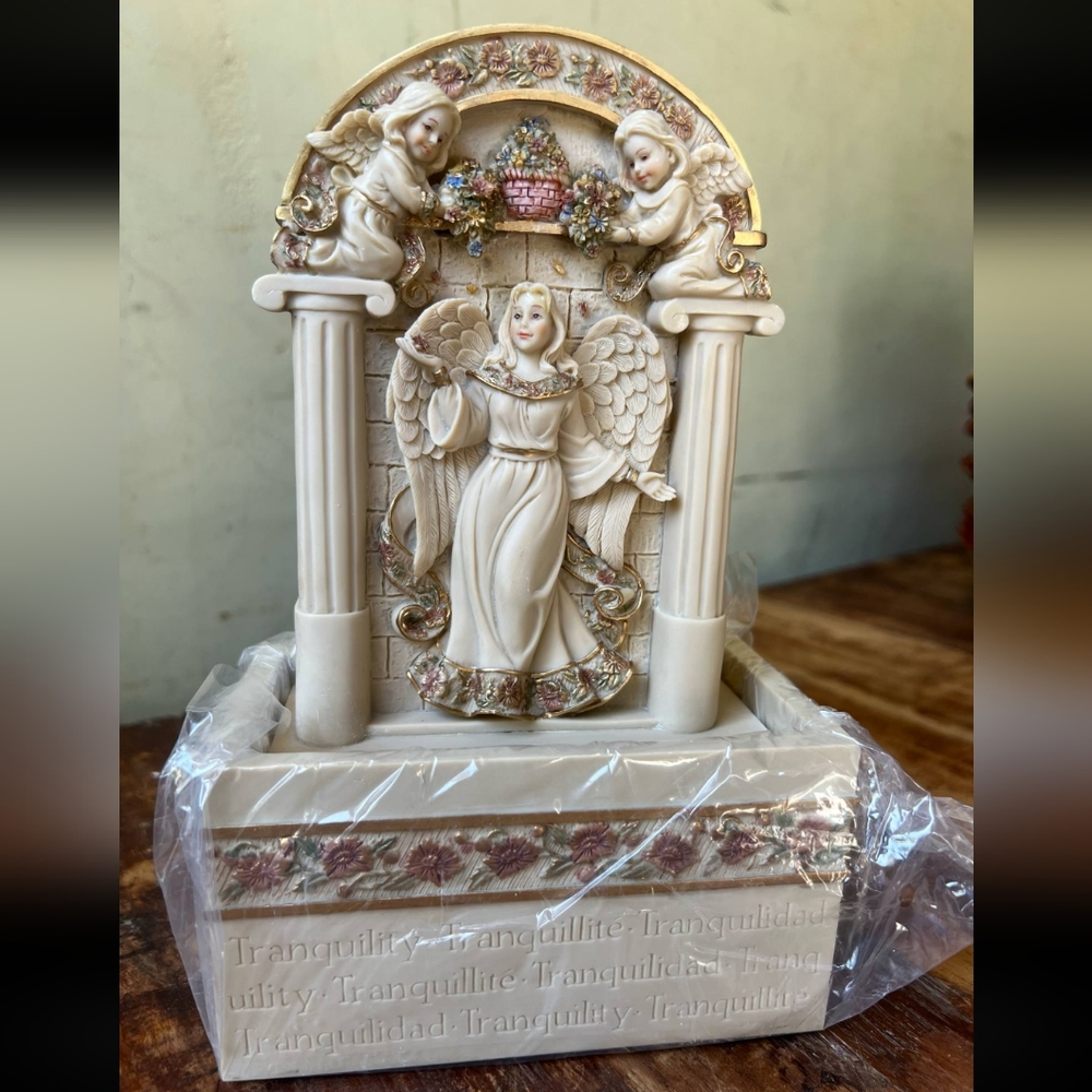 Sold!   Angel Figurine with Cherubs and Floral Accents
